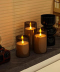 Grey Flameless Pillar Candles With Remote Control And Timer Battery Operated LED Candles Featuring Realistic 3D Flame Perspex Construction Pack Of 3 In D 3 Inch By H 4 Inch 5 Inch And 6 Inch Heights on a windowsill