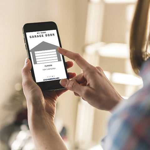 Person using smartphone app for MyQ WiFi Smart Garage Door Hub Lets You Open And Close Your Garage Door From Anywhere With Your Phone Real Time Alerts Plug And Play Setup With Existing Openers Works With Most Garage Door Systems Great For Homeowners.