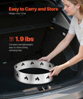 Person placing Stainless Steel Fire Pit Stand For Solo Stove Bonfire 19.5 Inch Ring Compatible Smokeless Fire Pit Frame in car trunk.