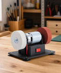 Pro Grade Dual Wheel Electric Bench Grinder on a wooden table with white and red grinding wheels, heavy duty design.