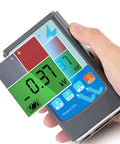 Genuine Static Meter And Electrostatic Fieldmeter For Quick ESD Touch Ups measuring voltage with LCD display in hand.