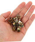 Heavy Duty Golden U Nut Fasteners For Truck And Rig 50 Pack in hand, metal clips for secure license plate mounting.