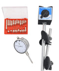 Dial indicator with magnetic base and long adjustable arm; white-faced gauge beside a red case of precision bits