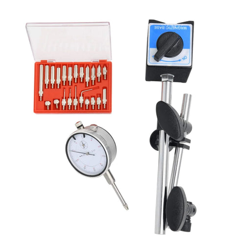 Dial indicator with magnetic base and long adjustable arm; white-faced gauge beside a red case of precision bits