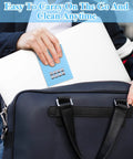 Front view of a blue lens-cleaning tissue packet being placed into a black leather bag.