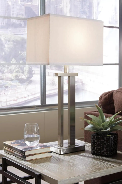 Aniela Minimalist Table Lamp Set of 2 in Silver Finish with Rectangular Shade on living room table, city view backdrop