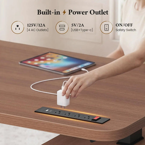 Hustle Ready L Shaped Electric Standing Desk Height Adjustable Executive Table With Walnut Finish showing built-in power outlet.