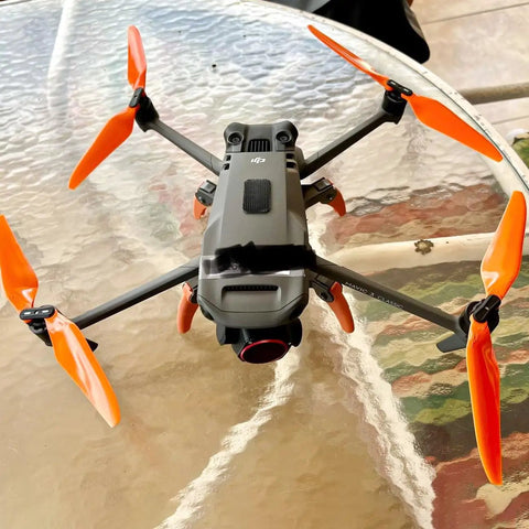 DJI Mavic 3 with Stealth Propellers For DJI Mavic 3 Series Orange 4 Pack Low Noise Up To 2 dB Reduction On glass table