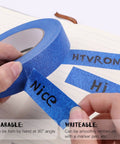 Blue Painters Tape 1 Inch By 180 Feet Per Roll, Three Rolls, shown with writing and tearing features on paper