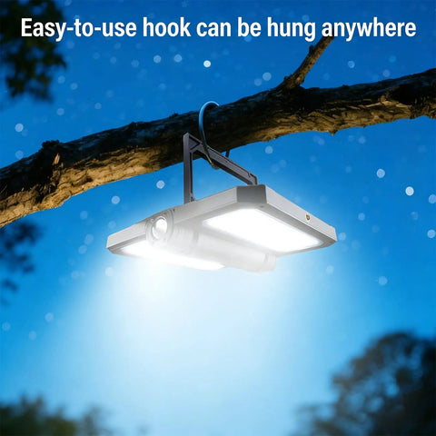 Portable Telescopic Camping Light With Adjustable Stand And Built In Power Supply hung on a tree branch