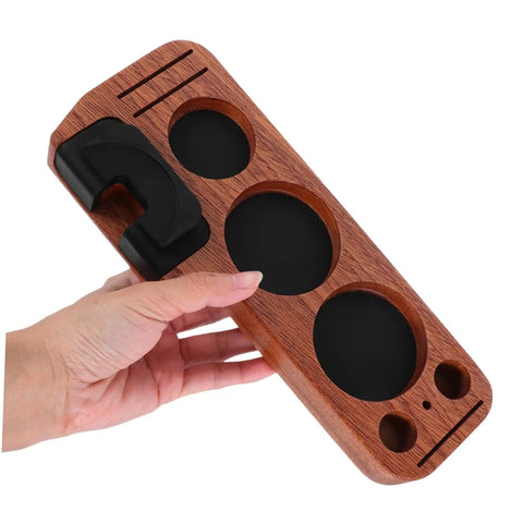 Sturdy Wooden Espresso Tamper Station Featuring Slick Portafilter Holder And Compact Coffee Organizer To Keep Your Kitchen Counter Looking Fresh And Totally Built For The Morning Rush, held in hand, showing light brown wood and black accents.
