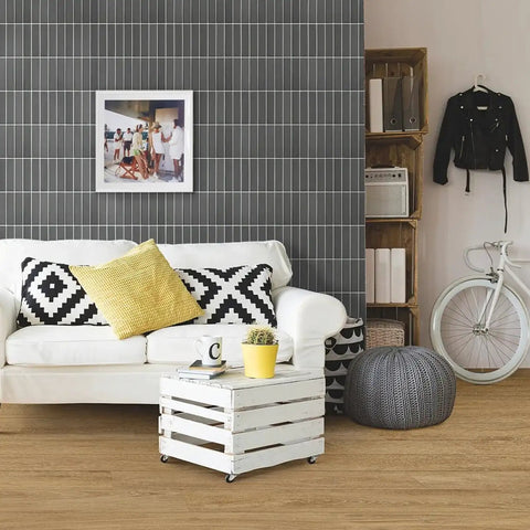 Living room with 3D Matte Green Peel And Stick Tiles Pack Of Ten Eleven Point Eight Inch Square PVC Backsplash Tiles on wall.