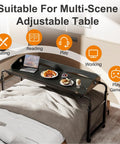 Super Handy Adjustable Laptop Desk For Bed With Wheels Overbed Table showcasing laptop and meal setup on a queen bed.