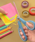 Blue-handled 8.5 Inch Pastel Scissors cutting colorful paper, part of 3 pack ultra sharp stainless steel heavy duty kitchen shears