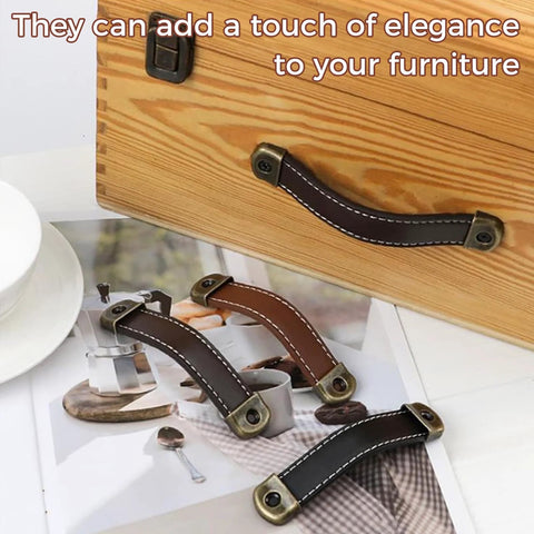 Image of a three piece leather wrapped drawer and cabinet handles set in brown zinc alloy finish with built in screws retro wardrobe door handles for dressers and cabinets 18 cm long adjustable leather grip hardware soft to the touch for comfortable grip and smooth placed on a wooden drawer showcasing their design and versatility.