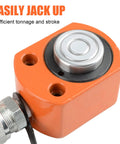 Hydraulic jack head in orange with silver round ram top and hose fitting (close-up view)