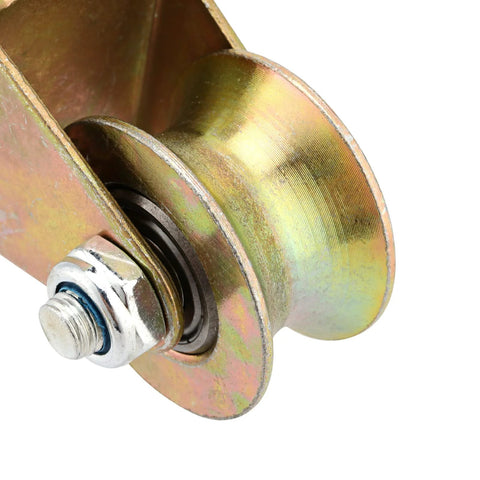 Close-up of a gold galvanized 6 Pack 2 Inch U Groove Wheel Pulley Kit With Steel U Type Track Wheel Rigid Caster.
