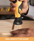Powerful Rotary Tool Kit With 6 Variable Speeds From 10000 To 35000 RPM in use for drilling and cutting on wood surface