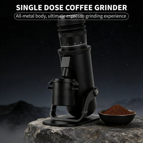 Heavy Duty Electric Burr Coffee Grinder With Sixty Fine Adjustments And 48 Millimeter Conical Steel Burrs For Dank Fresh Grinding And Smooth Barista Style Single Dose Pulls on a rocky surface with coffee grounds.