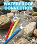 Beefy Marine Grade Heat Shrink Ring Connectors in water showing red, yellow, blue insulated terminals among rocks.