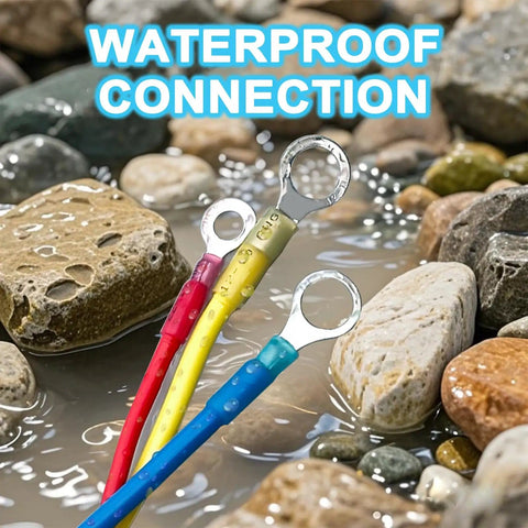 Beefy Marine Grade Heat Shrink Ring Connectors in water showing red, yellow, blue insulated terminals among rocks.