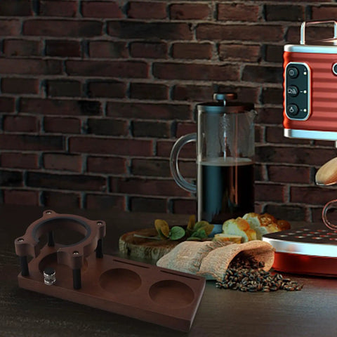 Game Changer Wooden Espresso Tamping Station Adjustable Fits 51 To 58 Mm Portafilter on a barista countertop with coffee tools.