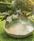 Green ceramic bird bath with two birds on rim in garden, ceramic bird bath bowl for outdoors green ground bird bath for garden lawn deck balcony patio durable outdoor bird waterer for birds easy to clean sturdy lightweight bowl backyard friendly.