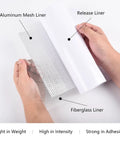 Hands holding Drywall Repair Patch Kit With Self Adhesive Aluminum Patches In 2 4 6 8 10 Inch Sizes Plus Scraper For Quick Fix Cracks In Walls Ceilings Roofs Plasterboard Drywall Repair 13 Piece Set showing aluminum mesh and fiberglass liner.