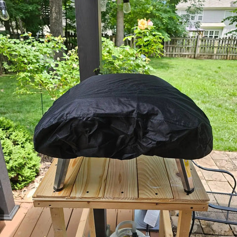 Heavy Duty 600D Pizza Oven Cover For Ooni Koda 16 Gas Oven on a table, showing outdoor weather-resistant protection.