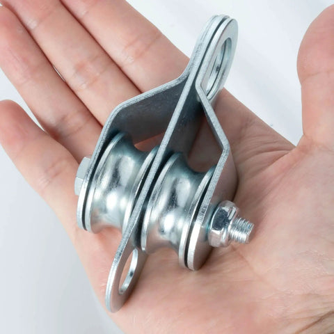 Double Snatch Block And Tackle Pulley System With Thirty Two Feet Of One Quarter Inch Rope And Hook Easy Install Heavy Duty Cable Pulley For Garage Attic Kayak Bike Lifting Up To One Hundred Fifty Pounds Side Opening Design, close-up in hand