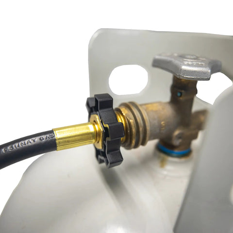 Five Foot Propane Hose Assembly for Disposable Cylinders to 20 Pound Tank attached to a brass fitting on a propane cylinder