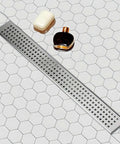 24 Inch Linear Shower Drain With Removable Square Hole Panel In Brushed 304 Stainless Steel on hexagonal tile floor