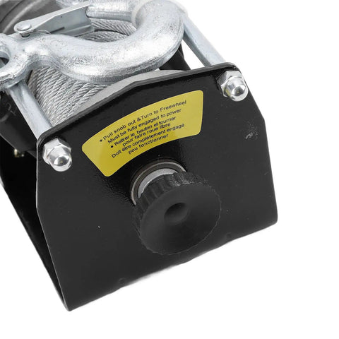 Close-up of Durable 12V Electric Winch Kit With 3000lbs Load Bearing Power showing control knob and warning label for off-road use.