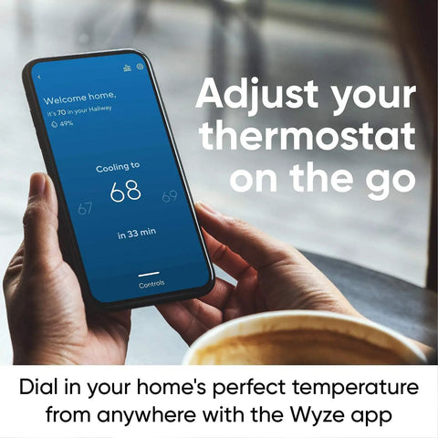 Person using a smartphone to control Smart WiFi Thermostat With App Control For Alexa And Google Assistant, No-Fuss DIY Install In Under 30 Minutes.
