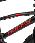 Close-up of Axilus Kids BMX Bike For Intermediate Riders with sturdy steel frame, showing brand logo on black and red design.