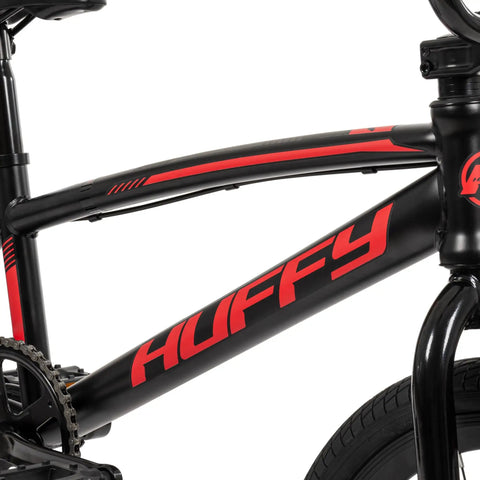 Close-up of Axilus Kids BMX Bike For Intermediate Riders with sturdy steel frame, showing brand logo on black and red design.