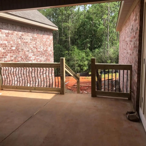 51 Pack 29.5 Inch Matte Black Iron Deck Balusters With Complete Hardware Kit For Exterior Stair Railing And Porch Safety Fences That Look Dope And Install Like A Breeze No Stress At All installed on a porch railing.