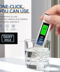 Hand using 4-In-1 Digital TDS Meter With EC And Temperature Readout For Drinking Water, Aquariums, And RO-RODI Systems, 0-9999 PPM Range.