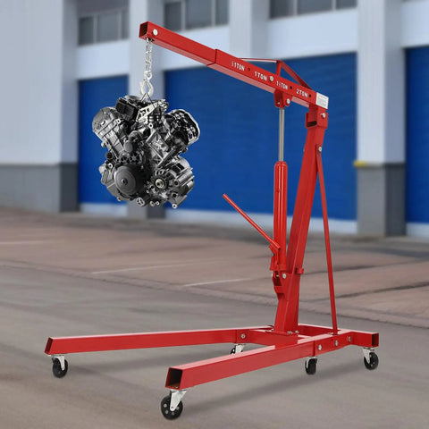 No Sweat Lifting Weights With This 2 Ton Folding Engine Hoist And Shop Crane lifting an engine with smooth rolling casters.