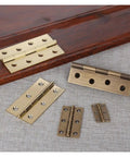 Solid Brass Concealed Hinge For Vintage Furniture Cabinets And Windows Hidden Mount Hardware set shown on wooden and fabric surfaces.