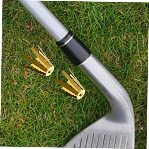Straight Up Solid Universal Brass Golf Shaft Shim Set Five Piece Kit beside a golf club on grass, showcasing alignment tool usage.
