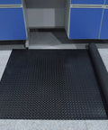 Heavy Duty 3.3 By 16 Ft Diamond Plate PVC Garage Floor Mat, 0.12 Inch Thick, Oil and Grease Resistant, rolled out on garage floor