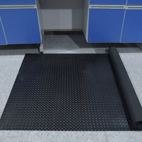 Heavy Duty 3.3 By 16 Ft Diamond Plate PVC Garage Floor Mat, 0.12 Inch Thick, Oil and Grease Resistant, rolled out on garage floor