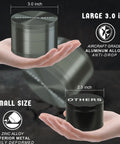 Image showing a Large 3.0 Inch Spice Grinder For Kitchen Tools With Magnetic Lid, Ergonomic Design, Gray Aluminum Finish in hand.