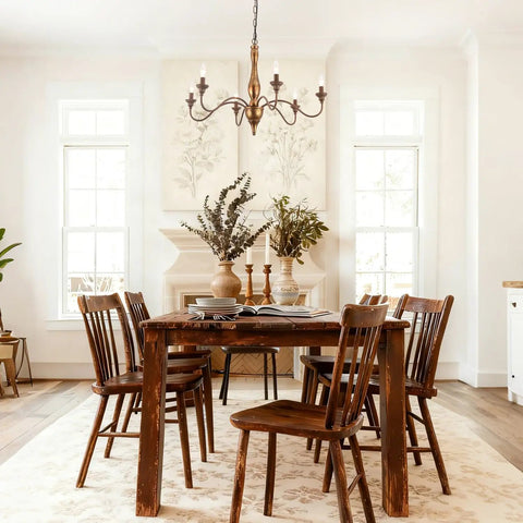 Dining room with Six Light Distressed White French Country Candle Chandelier With Cozy Vintage Vibe For Living Room Dining Room Bedroom 24 Inch Wide Rustic Ceiling Fixture over wooden table.
