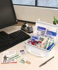 First Aid Kit, white plastic case, open to show 57-piece emergency contents (gauze, scissors, dressings)