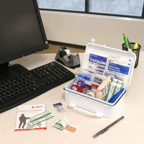 First Aid Kit, white plastic case, open to show 57-piece emergency contents (gauze, scissors, dressings)