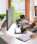 Bulletproof Monitor Arm Desktop Mount With Zero Hassle Height Adjustments And Hella Smooth Swivel Tilt Motion For Premium Ergonomic Office Setup. Woman using a monitor with desk mount.
