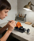 Heavy Duty Mini Drill Press Vise Clamp For Jewelry Milling And Wood Carving in use with a detailed craftsman at work.