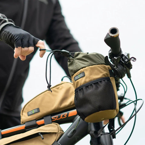Cyclist adjusts Bongo Bike Handlebar Bag Water Resistant Cordura 1000D Front Stem Bag With Water Bottle Holder on handlebars